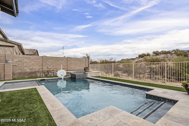 view of pool featuring a fenced backyard and a pool with connected hot tub