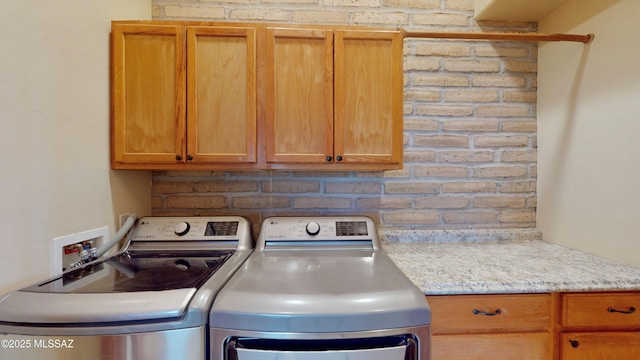 laundry area featuring cabinet space and washer and dryer