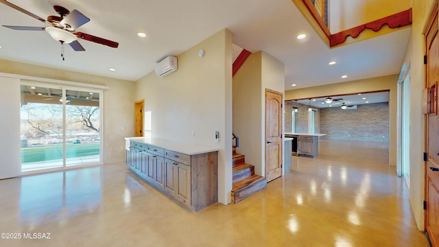 interior space featuring a ceiling fan, recessed lighting, concrete floors, and a wall mounted AC