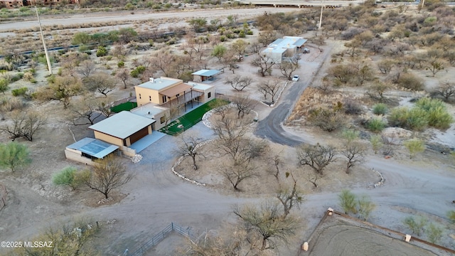 birds eye view of property with view of desert