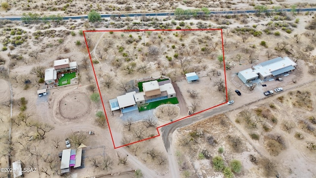 birds eye view of property featuring a desert view