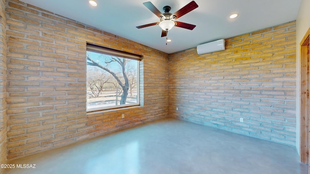 unfurnished room with a wall unit AC, recessed lighting, finished concrete floors, a ceiling fan, and brick wall