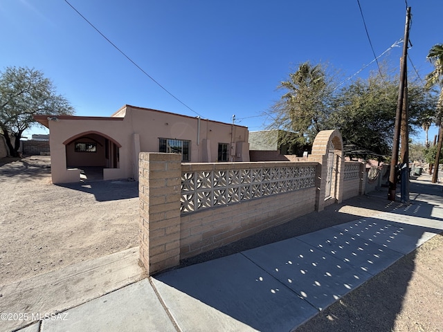 view of gate featuring a fenced front yard