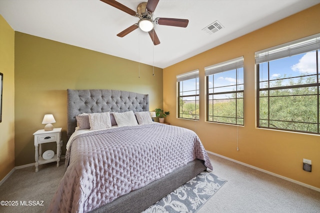 bedroom featuring carpet, baseboards, visible vents, and a ceiling fan