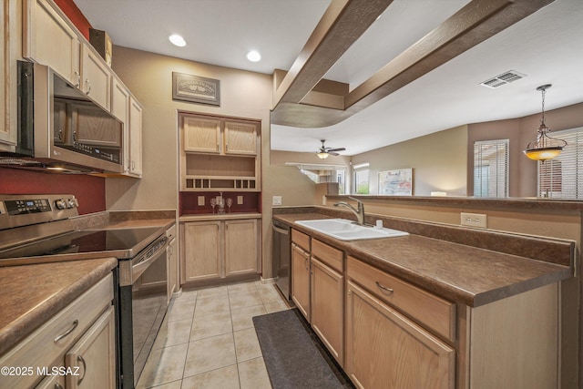 kitchen featuring light tile patterned floors, stainless steel appliances, visible vents, a sink, and a peninsula