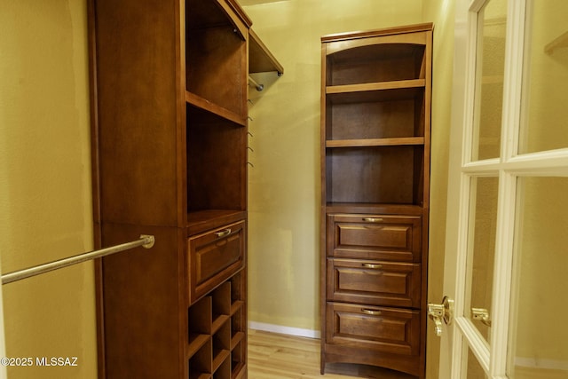 spacious closet with light wood-type flooring