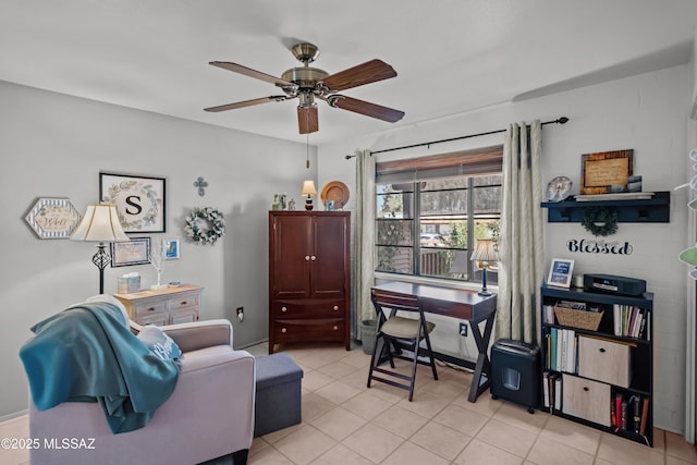 home office featuring light tile patterned flooring and a ceiling fan