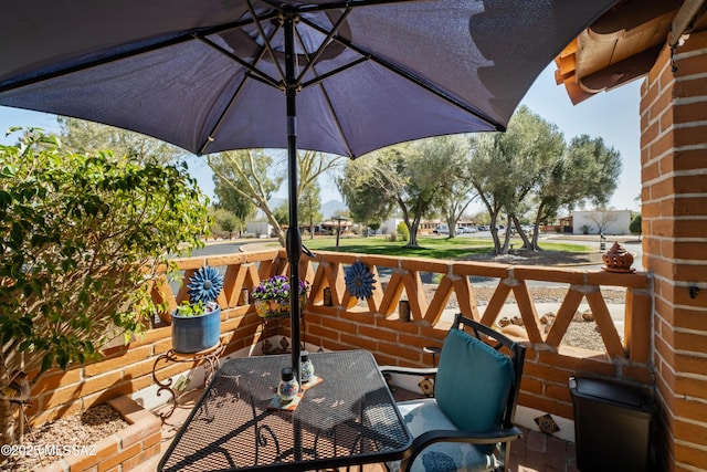 view of patio / terrace with outdoor dining space and a balcony