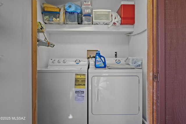 clothes washing area featuring independent washer and dryer