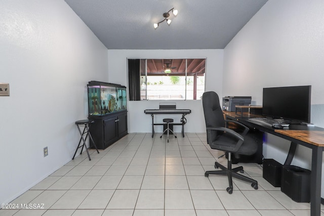 tiled home office featuring a textured ceiling