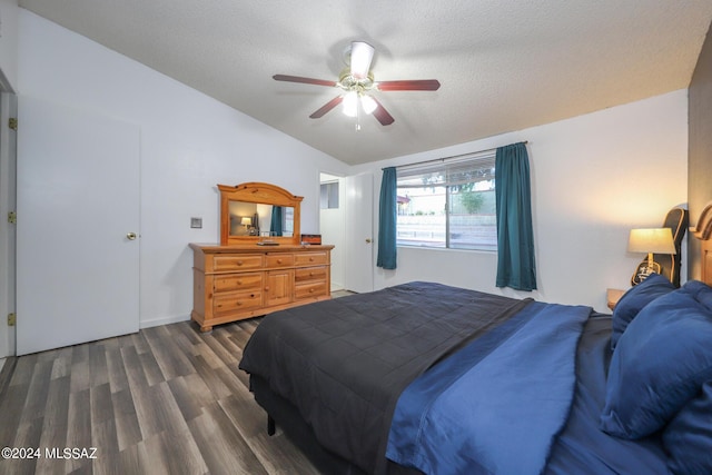 bedroom featuring dark wood-style floors, ceiling fan, and a textured ceiling