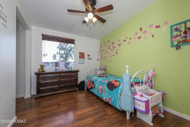 bedroom featuring a ceiling fan, baseboards, and wood finished floors