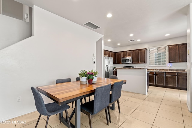 dining room featuring light tile patterned flooring, visible vents, and recessed lighting