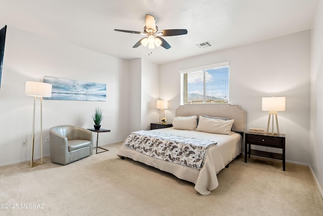 bedroom with carpet, visible vents, baseboards, and ceiling fan