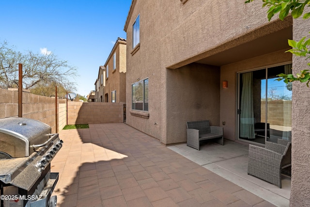 view of patio featuring a fenced backyard and grilling area