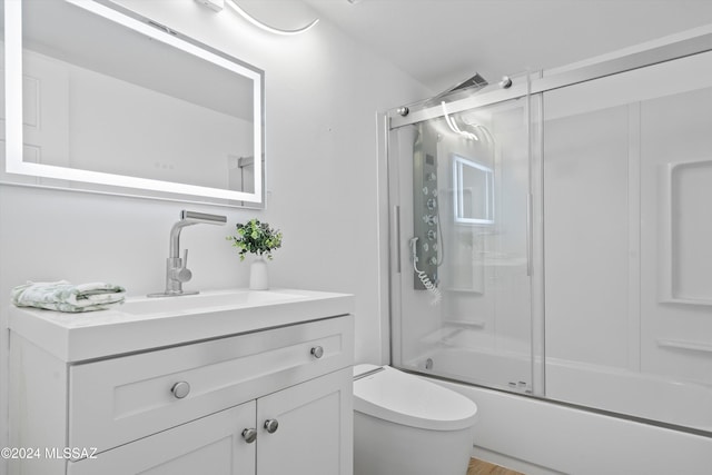 860 E Horsetail Ln, Tucson, AZ 85719 - bathroom featuring shower / bath combination with glass door, vanity, and toilet