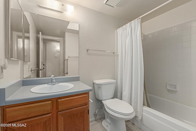 bathroom featuring shower / bath combo, vanity, toilet, and tile patterned floors