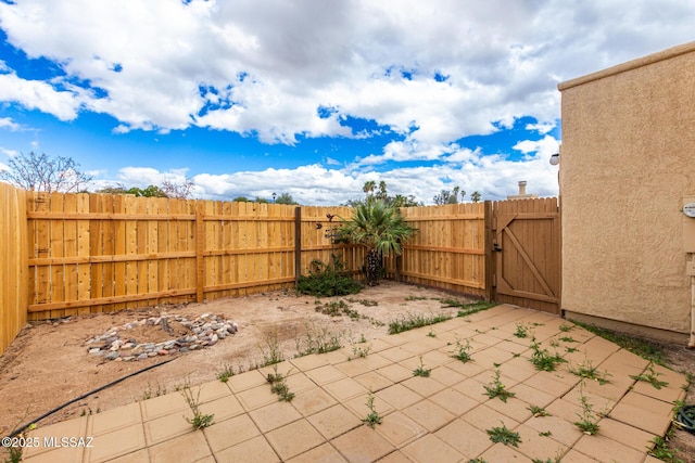 view of patio / terrace with a gate and fence