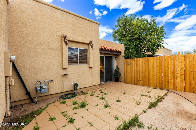 view of patio / terrace featuring fence