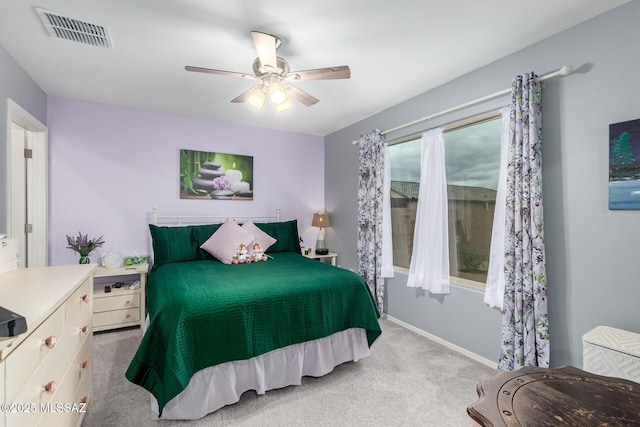 bedroom featuring visible vents, baseboards, carpet, and ceiling fan