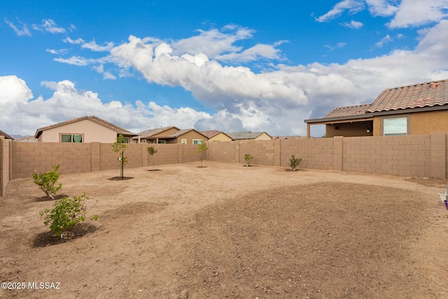 view of yard with a fenced backyard