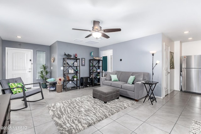 living room with light tile patterned floors, baseboards, recessed lighting, and a ceiling fan