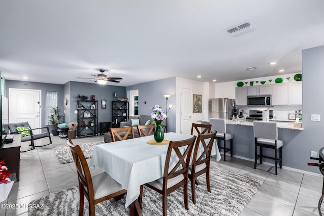 dining room with light tile patterned floors, visible vents, ceiling fan, and recessed lighting