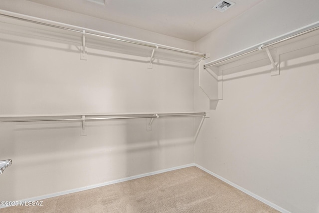 spacious closet featuring carpet floors and visible vents