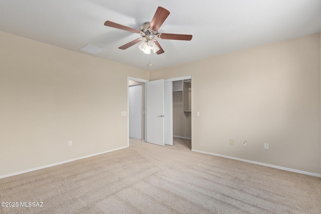 unfurnished bedroom with baseboards, a closet, a ceiling fan, and light colored carpet