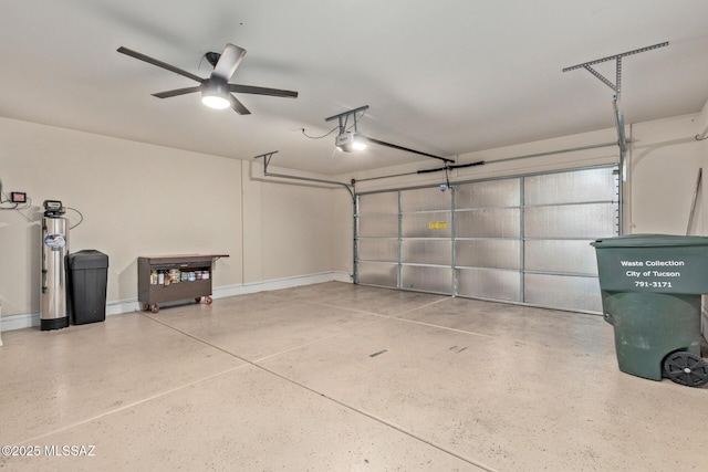 garage with baseboards and a garage door opener