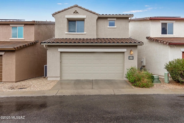 view of front of property with a garage, driveway, and stucco siding