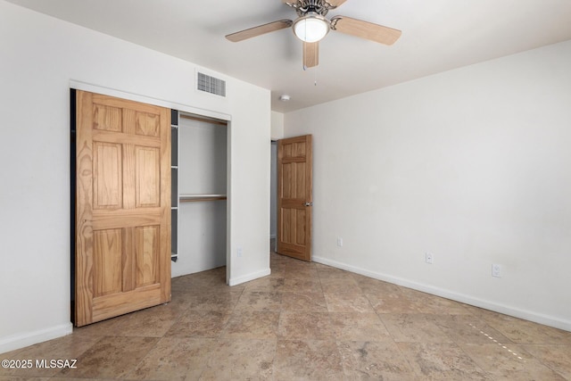 unfurnished bedroom with a closet, visible vents, ceiling fan, and baseboards