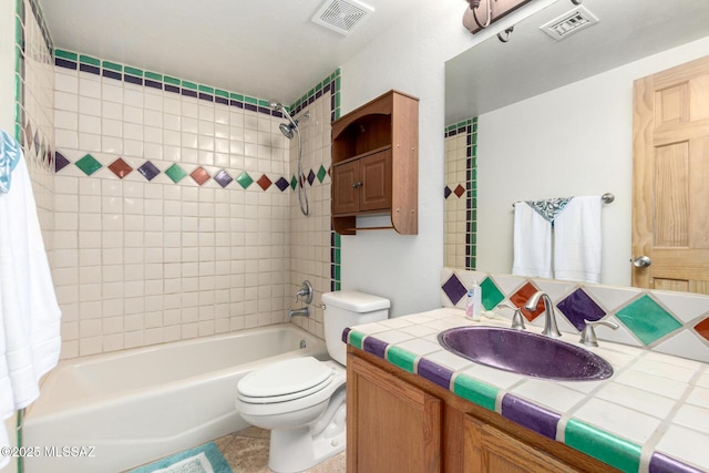 full bath featuring visible vents, shower / bathing tub combination, vanity, and toilet