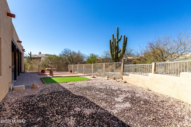 view of yard with a fenced backyard and a patio