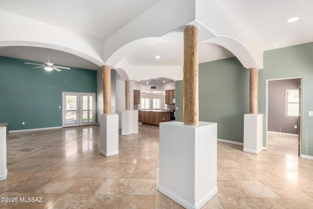 interior space with ceiling fan, light tile patterned floors, recessed lighting, and baseboards