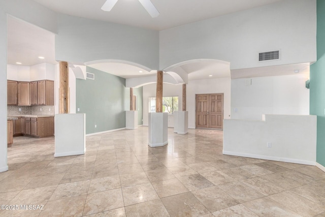 empty room with ceiling fan, recessed lighting, visible vents, and baseboards