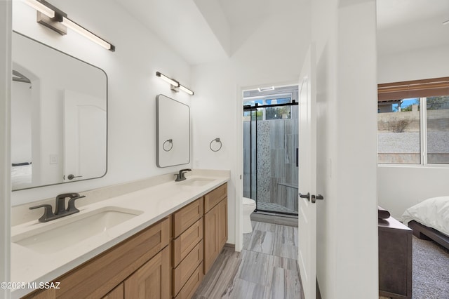 full bathroom with double vanity, a stall shower, ensuite bath, and a sink