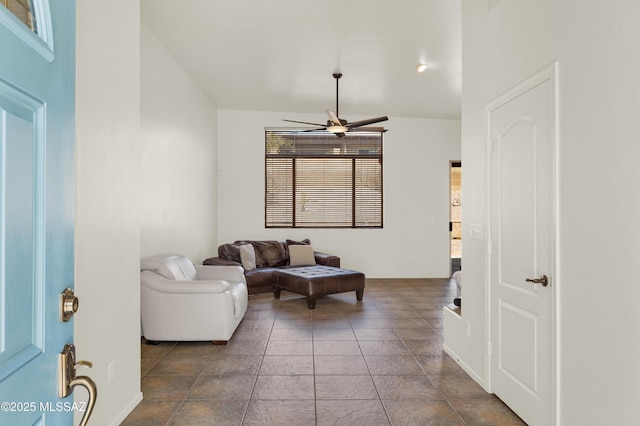 living area with a ceiling fan