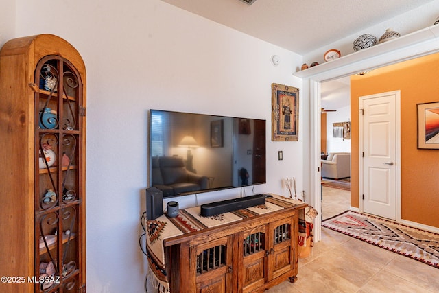 living area with light tile patterned floors