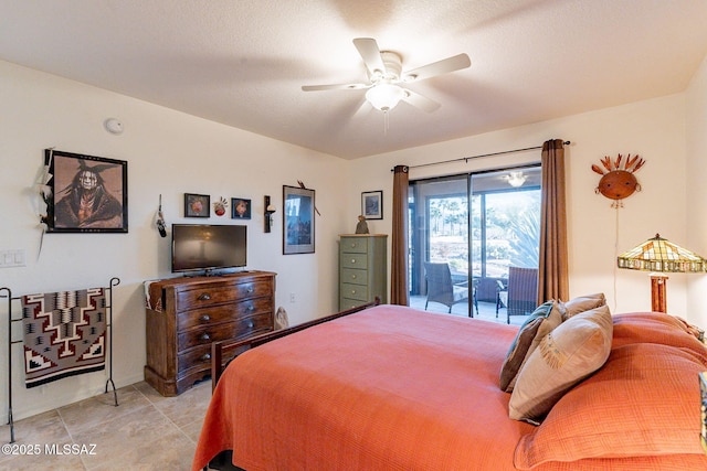 bedroom featuring a ceiling fan and access to exterior