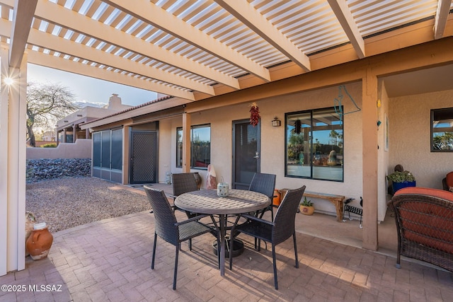 view of patio / terrace featuring outdoor dining area and a pergola