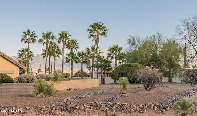 view of property's community featuring fence