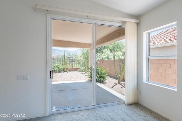 12220 N New Dawn Ave, Oro Valley, AZ 85755 - entryway featuring carpet floors, plenty of natural light, and a mountain view