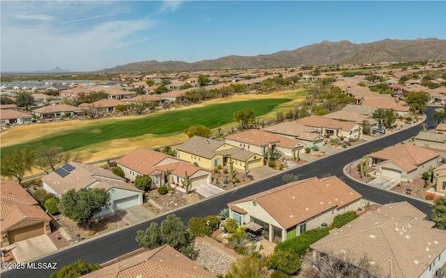 drone / aerial view with a residential view and golf course view