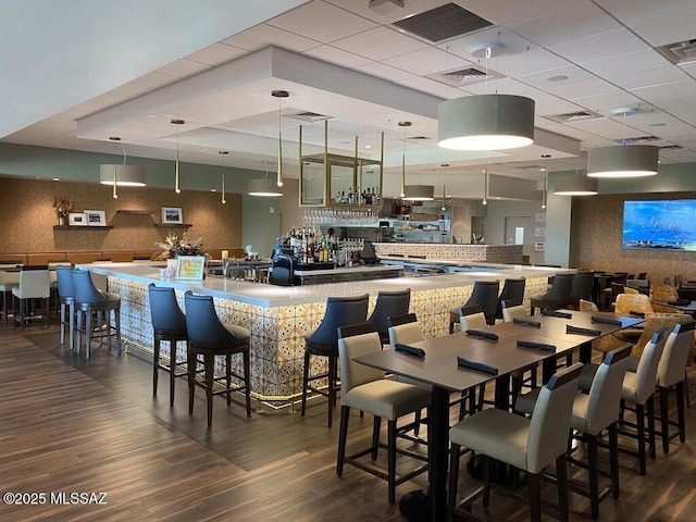 dining room with dark wood-style floors and visible vents