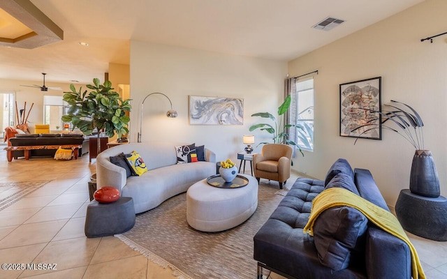 tiled living area featuring visible vents