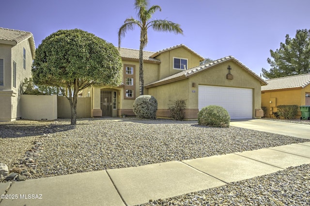 view of front of property featuring fence, driveway, an attached garage, stucco siding, and a tiled roof