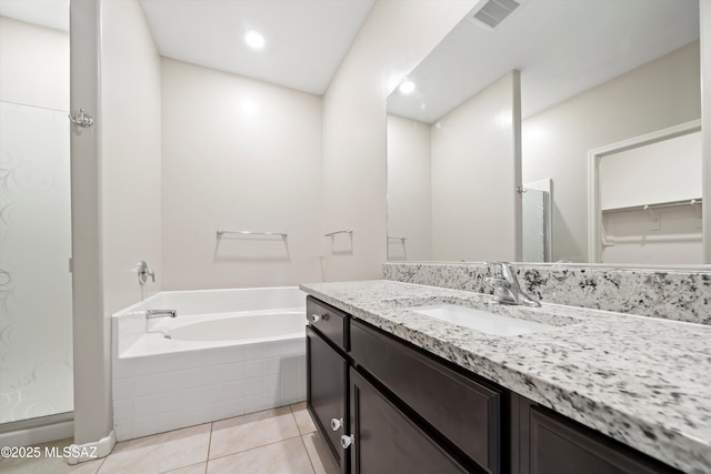 full bath with visible vents, walk in shower, a bath, tile patterned floors, and vanity