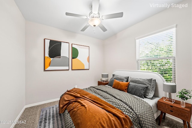 bedroom with carpet flooring, baseboards, and ceiling fan