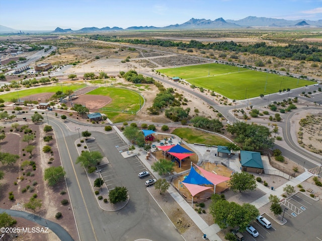 birds eye view of property with a mountain view